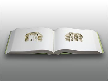 Casa tallada en un libro con un laser